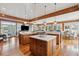 Spacious wooden kitchen with island, stainless appliances, and open floor plan to the dining area at 3 37Th Ave, Isle of Palms, SC 29451