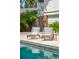 Inviting poolside area featuring lounge chairs, lush greenery, and comfortable lounging at 3 37Th Ave, Isle of Palms, SC 29451