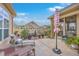 Inviting backyard patio with lounge chairs, plants, umbrella, and a peaceful setting at 301 Blakely Village Ln, Summerville, SC 29486
