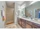 Bathroom featuring double vanity, tile flooring and a walk-in shower at 301 Blakely Village Ln, Summerville, SC 29486