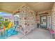 Charming front porch with colorful Adirondack chairs and a welcoming entrance at 301 Blakely Village Ln, Summerville, SC 29486