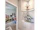 Hallway nook showcasing decorative shelving and access to the bedroom at 301 Blakely Village Ln, Summerville, SC 29486