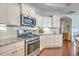 Modern kitchen with stainless steel appliances, granite countertops, ample cabinetry, and hardwood floors at 301 Blakely Village Ln, Summerville, SC 29486