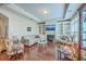 Bright living room boasts hardwood floors, built-in shelves, a cozy fireplace, and comfortable furnishings at 301 Blakely Village Ln, Summerville, SC 29486
