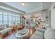 Bright open-concept living room features hardwood floors, comfortable seating, and access to the kitchen at 301 Blakely Village Ln, Summerville, SC 29486