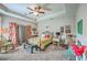 Comfortable main bedroom with a tray ceiling and sitting area at 301 Blakely Village Ln, Summerville, SC 29486