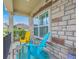 Cozy porch featuring stylish outdoor seating and a charming stone exterior with great natural light at 301 Blakely Village Ln, Summerville, SC 29486