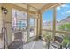 Cozy screened porch offers outdoor seating with a view of the backyard at 301 Blakely Village Ln, Summerville, SC 29486