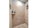 Close-up of tiled walk-in shower with recessed shelf and shower head at 301 Blakely Village Ln, Summerville, SC 29486