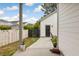 Cozy backyard patio with a black gate, white fence, concrete pavers, and white siding at 308 Scholar Way, Summerville, SC 29486