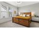Bright bedroom with a cozy rug and unique wooden headboard and bedframe at 308 Scholar Way, Summerville, SC 29486