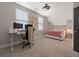 Contemporary room with a plush rug, workstation, and cozy bed with soft lighting at 308 Scholar Way, Summerville, SC 29486