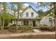 Charming two-story home features a cozy front porch and beautifully landscaped front yard at 308 Scholar Way, Summerville, SC 29486