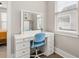 Chic vanity area with a white makeup desk, a framed mirror and natural light at 308 Scholar Way, Summerville, SC 29486