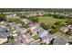 Picturesque neighborhood with colorful houses and well-maintained lawns and garages at 311 Amaryllis Ave, Summerville, SC 29483