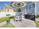 Backyard featuring an umbrella-covered patio, ideal for relaxation and grilling at 311 Amaryllis Ave, Summerville, SC 29483