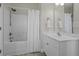 Clean bathroom with a shower-tub combo, neutral walls and a simple, modern vanity at 311 Amaryllis Ave, Summerville, SC 29483