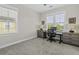 Bright bedroom with neutral tones, large windows and modern furnishings creates a welcoming and comfortable atmosphere at 311 Amaryllis Ave, Summerville, SC 29483