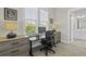 Comfortable bedroom with modern gray wooden cabinets, a black desk and black desk chair, creating a cozy workspace at 311 Amaryllis Ave, Summerville, SC 29483