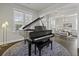 Bright piano room with hardwood floors, a grand piano, and ample natural light at 311 Amaryllis Ave, Summerville, SC 29483