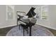 Elegant music room featuring a grand piano and natural light at 311 Amaryllis Ave, Summerville, SC 29483