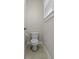 Simple powder room with classic white fixtures and a clean, minimalist design at 311 Amaryllis Ave, Summerville, SC 29483