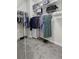 Organized walk-in closet with shelving, hanging space, and a full-length mirror at 311 Amaryllis Ave, Summerville, SC 29483
