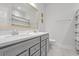 This elegant bathroom boasts a double vanity with quartz countertops, framed mirror, and modern finishes at 3130 Sturbridge Rd, Mount Pleasant, SC 29466