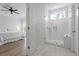 An ensuite bathroom offers a walk-in glass shower with a bench and adjoins a well-lit main bedroom at 3130 Sturbridge Rd, Mount Pleasant, SC 29466