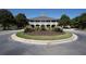 Beautiful community clubhouse with a landscaped roundabout entrance, making a welcoming statement at 3130 Sturbridge Rd, Mount Pleasant, SC 29466