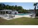 Community pool with ample seating, a pergola, and bath house at 3130 Sturbridge Rd, Mount Pleasant, SC 29466