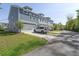 Charming townhome exterior with attached garage, well-maintained lawn, and private driveway at 3130 Sturbridge Rd, Mount Pleasant, SC 29466