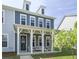 Charming two-story home with a welcoming front porch and manicured lawn at 3130 Sturbridge Rd, Mount Pleasant, SC 29466
