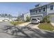 Attractive townhome exterior with attached garage, well-maintained lawn, and private driveway at 3130 Sturbridge Rd, Mount Pleasant, SC 29466