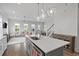 Well-appointed kitchen with an island and seamless flow to the living and dining areas at 3130 Sturbridge Rd, Mount Pleasant, SC 29466