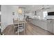 Open-concept living space with modern light fixtures and natural light at 3130 Sturbridge Rd, Mount Pleasant, SC 29466