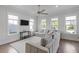 Spacious living room with a large sectional sofa and abundant natural light at 3130 Sturbridge Rd, Mount Pleasant, SC 29466