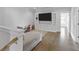 Bright living room with entertainment center, and access to additional rooms at 3130 Sturbridge Rd, Mount Pleasant, SC 29466