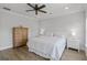 A cozy main bedroom features a ceiling fan, wood floors, and ample natural light at 3130 Sturbridge Rd, Mount Pleasant, SC 29466