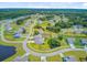 Community aerial shot showcases meticulously planned streets, mature trees, and tranquil ponds at 3154 Hugh Bennett Dr, Johns Island, SC 29455