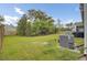 Lush backyard with mature trees and a well-maintained lawn, offering ample space at 3154 Hugh Bennett Dr, Johns Island, SC 29455