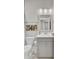 Cozy bathroom with modern vanity, framed mirror, and decorative wall art at 3154 Hugh Bennett Dr, Johns Island, SC 29455