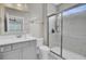 Bright bathroom features a white vanity, toilet, and glass-enclosed walk-in shower at 3154 Hugh Bennett Dr, Johns Island, SC 29455