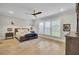 Spacious bedroom featuring wood floors, recessed lighting, a ceiling fan, and large windows at 3154 Hugh Bennett Dr, Johns Island, SC 29455