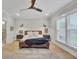 Serene main bedroom featuring a ceiling fan, hardwood floors, and windows at 3154 Hugh Bennett Dr, Johns Island, SC 29455