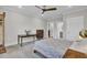 Spacious bedroom with ceiling fan, neutral decor, carpet and views of an ensuite bathroom at 3154 Hugh Bennett Dr, Johns Island, SC 29455