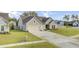 Well-maintained single-Gathering home with a two-car garage, lush green lawn, and inviting curb appeal at 3154 Hugh Bennett Dr, Johns Island, SC 29455