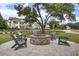 A brick fire pit with Adirondack chairs creates a relaxing outdoor gathering space at 3154 Hugh Bennett Dr, Johns Island, SC 29455