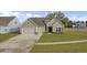 Charming single-Gathering home with a gray exterior, a well-manicured lawn, and an attached two-car garage at 3154 Hugh Bennett Dr, Johns Island, SC 29455