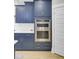 Kitchen featuring stainless steel double oven, subway tile backsplash, and shaker-style cabinets at 3154 Hugh Bennett Dr, Johns Island, SC 29455